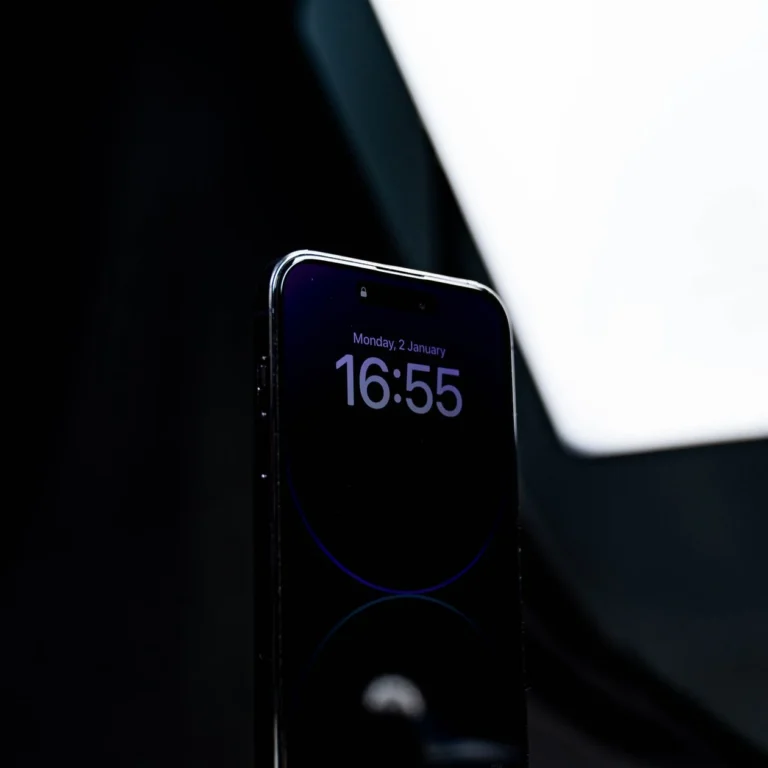 iPhone lock screen showing 16:55 in 24-hour military time format